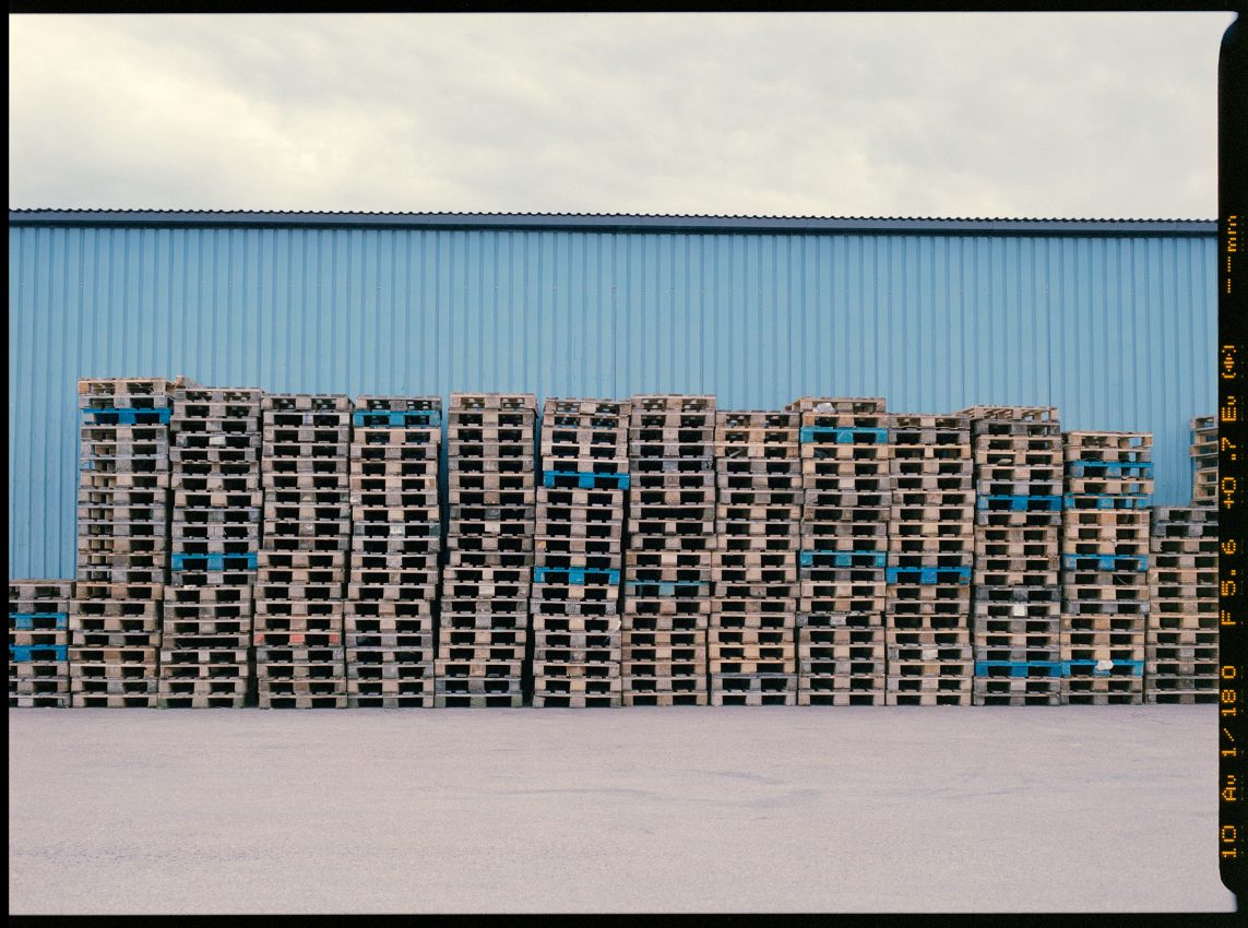 medium format colour film photograph of shipping pallets in Gothenburg Sweden