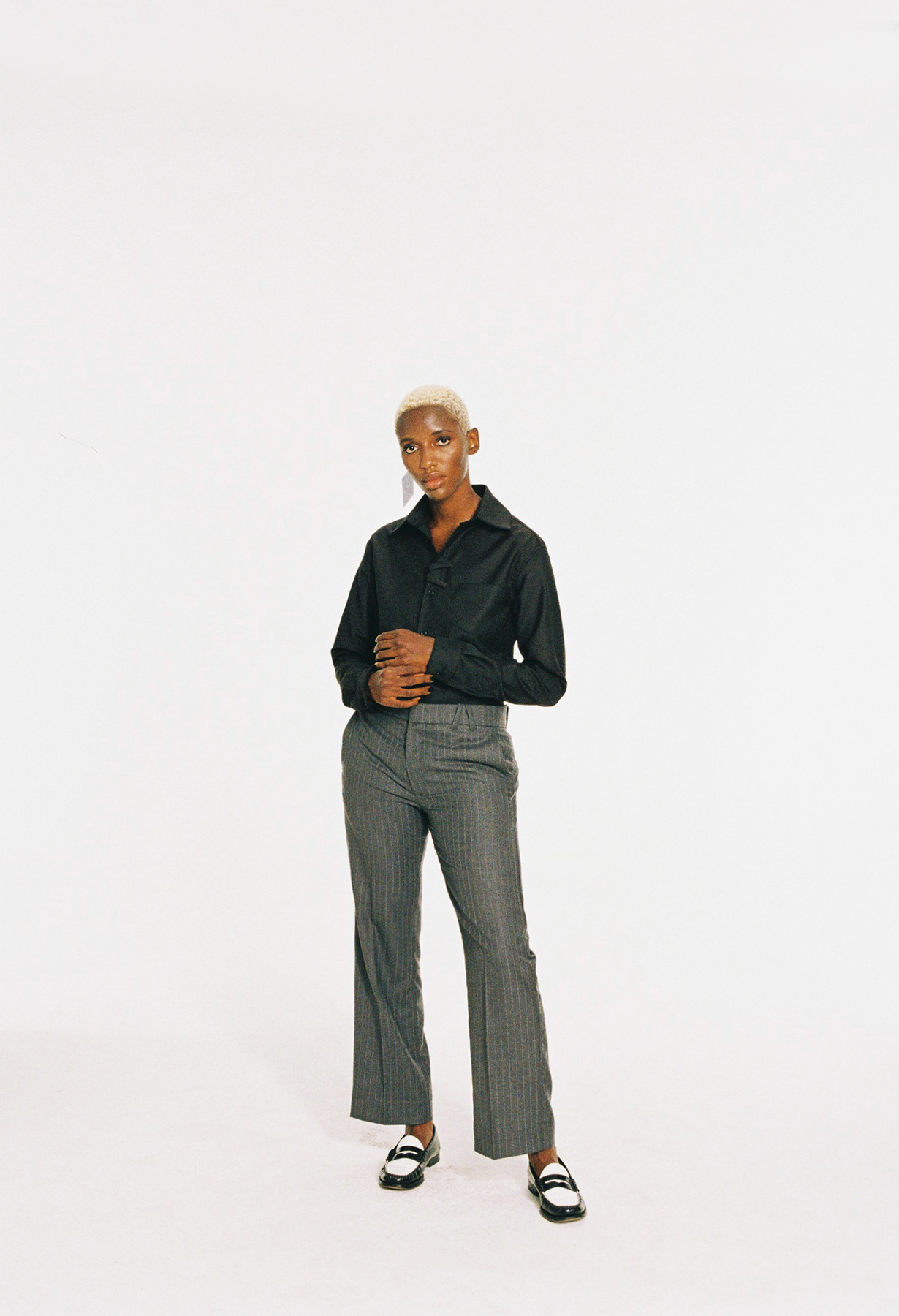 35mm film colour studio image of a model wearing Armand Basi